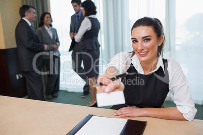 Happy woman handing you a name tag