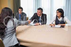 Interviewee shaking hands with panel member