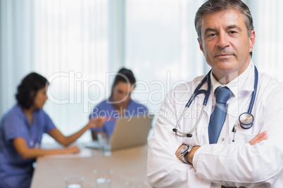 Doctor standing with arms crossed