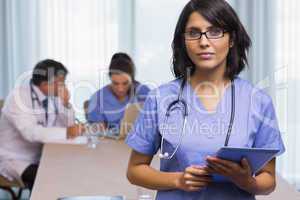 Nurse standing with tablet pc