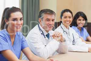 Smiling panel of doctors and nurses