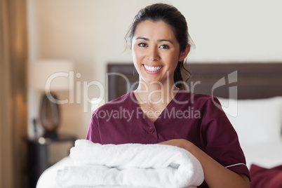 Happy maid with towels