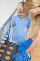 Mother and her son baking cookies