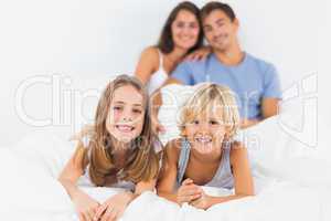 Children lying on the bed