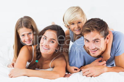 Parents giving their children piggyback ride