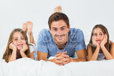 Father and her children looking at camera