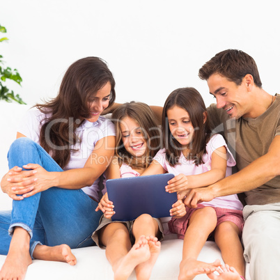 Pretty family using a digital tablet