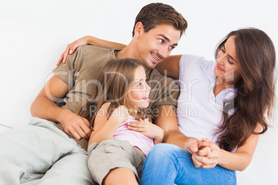 Lovely family playing together on a sofa