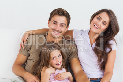 Happy family sitting together on a sofa