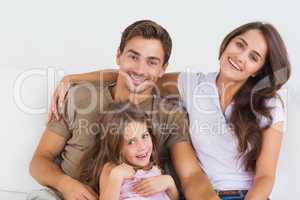 Happy family sitting together on a sofa