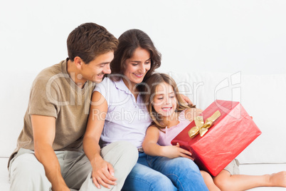 Parents offering a gift