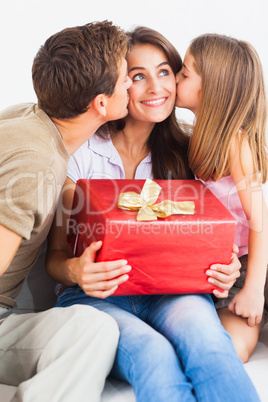 Father and his daughter offering a gift