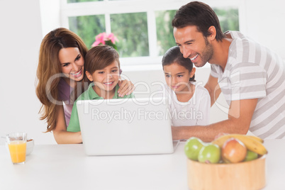 Family using a laptop