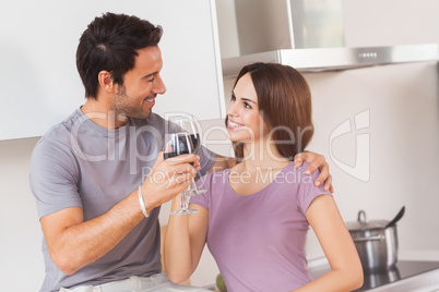 Lovers toasting with a glass of wine