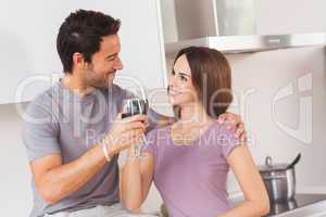 Lovers toasting with a glass of wine