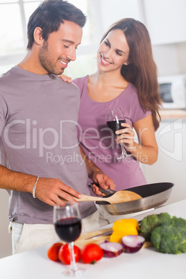Lovers preparing food and drinking
