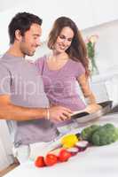 Couple preparing food at the stove