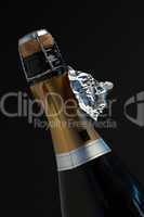 Top of bottle of champagne with ripped foil