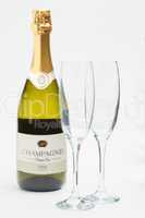 Bottle of champagne with two flutes