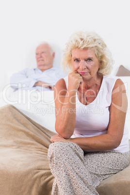 Disappointed old woman sitting