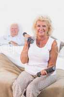 Old woman lifting weights