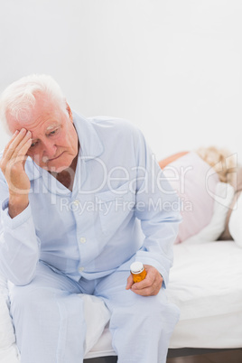 Old man having a headache