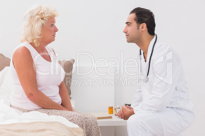 Old woman consulting a doctor