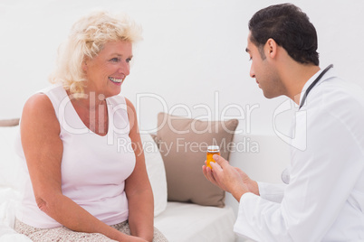 Doctor giving a prescription to patient