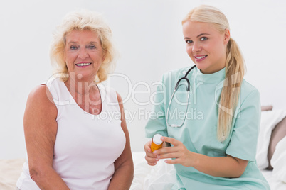 Home nurse and patient posing