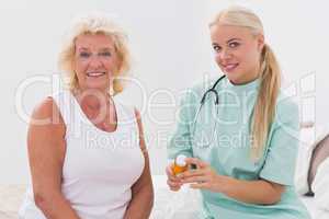 Home nurse and patient posing