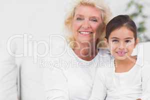 Cheerful granddaughter and grandmother portrait