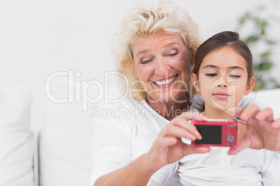 Granddaughter and grandmother taking pictures