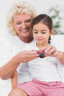 Granddaughter and grandmother looking at pictures