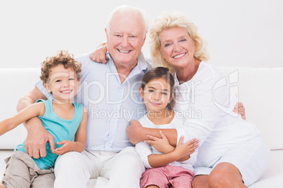 Cheerful grandparents with children