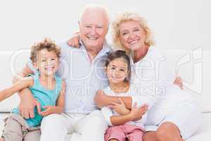 Cheerful grandparents with children