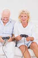 Old couple playing video games