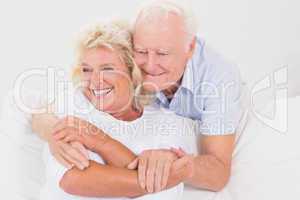Old couple embracing