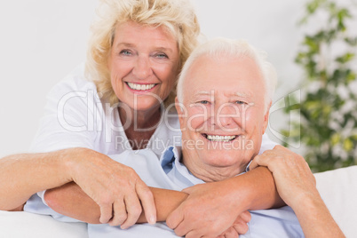 Happy old couple portrait hugging