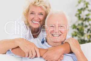 Happy old couple portrait hugging