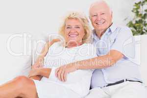 Joyful old couple portrait hugging