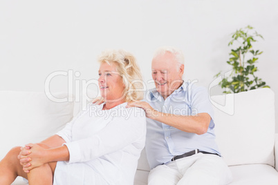 Old man massing a elderly woman