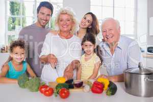 Multi-generation family cutting vegetables together