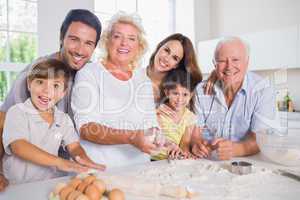 Smiling family baking together