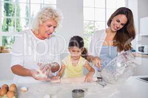Multi-generation family women baking together