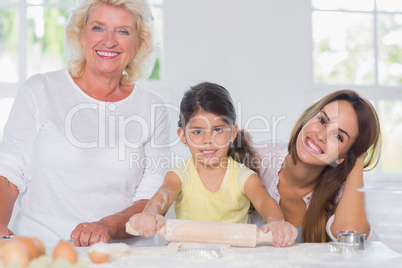 Happy women of a family baking together