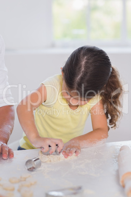 Little girl preparing cookies