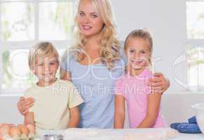 Blonde family smiling at the camera