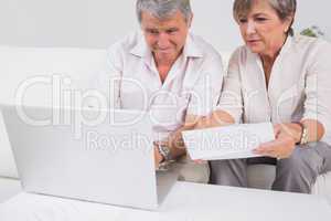 Old couple not understanding the accounts and using laptop