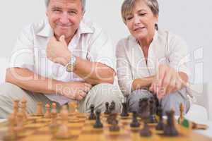 Old couple playing chess