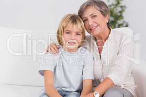Portrait of a little boy and his grandmother smiling